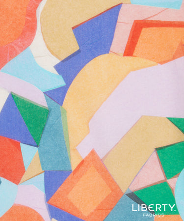 A close-up of Liberty Fabrics' abstract geometric pattern featuring overlapping shapes in orange, yellow, blue, green, pink, and light blue.