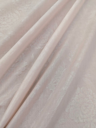 Close-up of textured light pink fabric