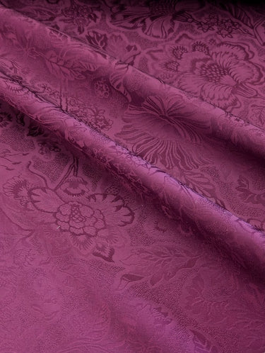 Close-up of purple fabric with floral pattern