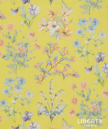 Floral pattern on a yellow background with Liberty Fabrics branding.