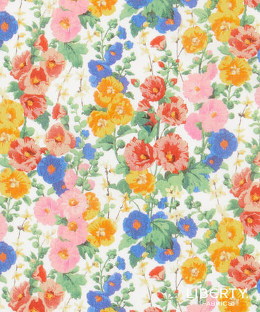 A close-up of Liberty Fabrics floral pattern featuring pink, orange, yellow, and blue flowers with green leaves on a white background.