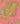 A close-up of a paisley pattern with ornate floral and teardrop motifs in orange, teal, yellow, and white on a pink background.
