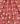 A close-up of a red fabric with a floral print featuring white and pink blossoms and green leaves, with a visible Liberty Fabrics logo in the bottom right corner.