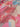 Close-up of fabric with pink, blue, and beige abstract pattern