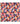 A close-up of a colorful abstract fabric pattern with watercolor-like splashes in pink, red, orange, yellow, blue, purple, and white.