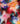 A close-up of draped Liberty Fabrics featuring a vibrant, painterly abstract pattern with blended shades of red, pink, purple, teal, orange, and white.