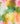 Abstract watercolor fabric pattern with blended pastel pink, green, yellow, orange, and white tones.