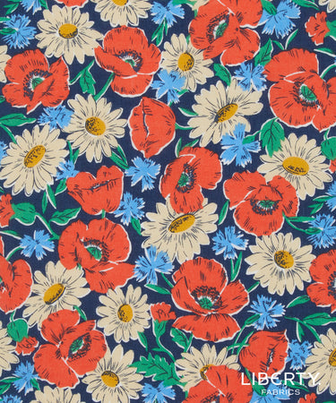 Floral pattern with red poppies, white daisies, and blue flowers on a navy background, featuring the Liberty Fabrics logo.