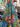 Colorful floral fabric with a tropical pattern in a store setting