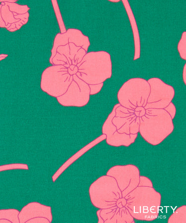 A close-up of Liberty Fabrics floral pattern featuring pink flowers and stems on a vibrant green background.