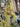 Floral patterned fabric with a yellow background draped in a store setting