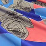 Fabric with floral pattern on a blue and pink check