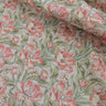 Floral patterned fabric with pink and green flowers on a neutral background