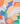 A close-up of Liberty Fabrics' abstract geometric pattern featuring overlapping shapes in orange, yellow, blue, green, pink, and light blue.