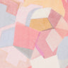 A close-up of Liberty Fabrics' abstract geometric patterned fabric, featuring overlapping shapes in soft pink, peach, yellow, light blue, and cream. 