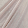 Close-up of textured light pink fabric