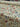 Roll of floral fabric with colourful flowers on a cream background