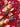 Close-up of a printed wool fabric with yellow flowers on a red background