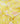 Yellow fabric with a dense floral print featuring pink, peach, and white flowers with green leaves.