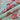 Floral fabric with pink and red flowers on a pastel background