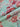 Floral fabric with pink and red flowers on a pastel background