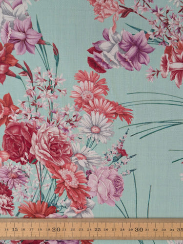 Floral fabric pattern with a ruler at the bottom for scale on a pastel background