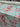 Floral fabric with pink and red flowers on a pastel background