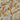Close-up of a printed pure cotton fabric with ivory botanical print on a mustard base.