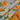Floral fabric with yellow and white flowers on a polka dot background