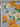 Floral fabric with yellow and white flowers on a polka dot background, featuring Emanuel Ungaro branding.
