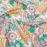 A close-up of Liberty Fabrics floral print fabric featuring a retro paisley and floral pattern in green, yellow, orange, white, and purple.