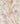 A close-up of Liberty Fabrics floral print fabric in a soft blush pink color, featuring delicate watercolor-style purple flowers, green leaves, and peach blossoms, with the 'LIBERTY FABRICS' logo in the bottom right corner.