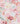 A close-up of Liberty Fabrics floral pattern featuring stylized flowers and leaves in pink, peach, cream, sage green, and burgundy on a light pink background.