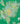 A close-up of a green fabric or wallpaper pattern featuring a detailed paisley and floral design in yellow, light blue, and olive green.