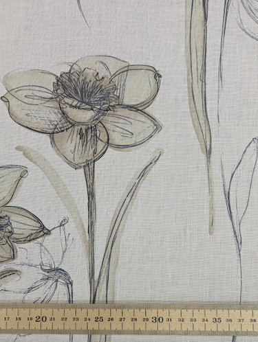 Sepia toned daffodil pattern on a light pink base, featuring a ruler for scale.