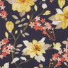 A close-up of Liberty Fabrics floral pattern featuring yellow magnolia flowers, coral pink blossoms, and cream leaves on a dark navy background.
