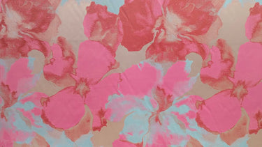 Large abstract floral pattern with pink, red and blue colours on a textured background