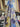Floral fabric with blue and white flowers draped in a fabric store setting