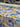 Roll of floral fabric with blue, yellow, and purple flowers.