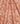 A close-up of a draped fabric with a classic paisley pattern in soft pink, peach, and orange tones, with a 'LIBERTY FABRICS' logo in the bottom right corner.