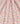 A close-up of a floral fabric with a repeating pattern of peach, pink, yellow, and green flowers on a pale blue background. The fabric is draped with soft vertical folds, and a watermark for 'LIBERTY FABRICS' is visible in the bottom right corner.