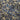 Close-up of a printed pure cotton batiste, with a geometric motif in cobalt blue, ivory, and black, with interlocking circles and angular lines.