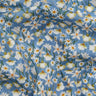 Light blue fabric with an all-over daisy print, featuring white petals, yellow centers, and green stems. A watermark for 'LIBERTY FABRICS' is visible in the bottom right corner.