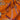 Close-up of a printed pure wool fabric with intertwined ropes, tassels, and chains on a vivid orange ground