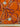 Close-up of a printed pure wool fabric with intertwined ropes, tassels, and chains on a vivid orange ground, and a ruler shown at the bottom for scale.