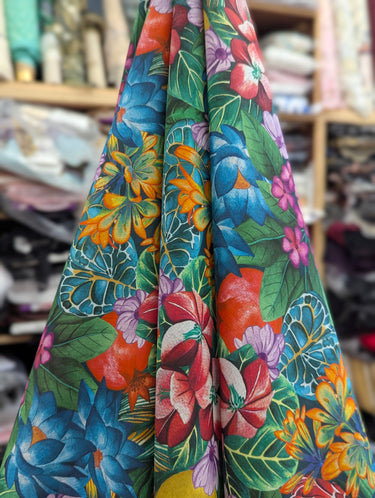 Colorful floral fabric with a tropical pattern in a store setting