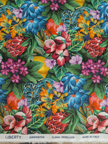 Colorful floral fabric pattern with Liberty of London branding.