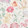 A close-up of a floral fabric pattern featuring pink, peach, purple, and yellow flowers with green leaves on a warm off-white background. The Liberty Fabrics logo is visible in the bottom right corner.