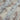 Close-up view of shimmer printed chiffon fabric with floral patterns.