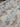 Close-up view of shimmer printed chiffon fabric with floral patterns.
